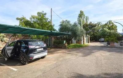 a small car parked in a parking lot at Stunning Home In Querciolo in Venzolasca