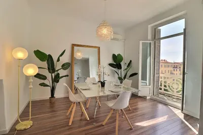 a living room with two couches and a dining room at Casa Napoléon - Elegance & Comfort in the City Center - Clim in Ajaccio