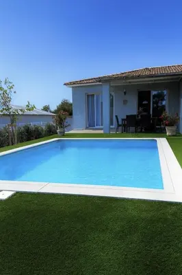 a swimming pool in the yard of a house at Maison Dolce Vita in Ghisonaccia