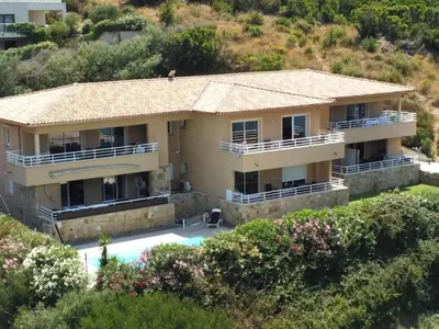 an aerial view of a house with a swimming pool at T3 - bord de mer - piscine - vue magnifique in Propriano