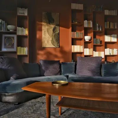 a living room with a couch and a coffee table at Lenza Barn Villa by Boutique Scenic Corsica in Pianottoli-Caldarello