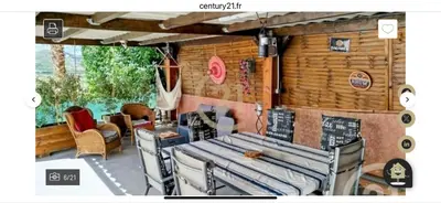a patio with a table and chairs and a wall at Casa pace e salute in Olmeta-di-Tuda