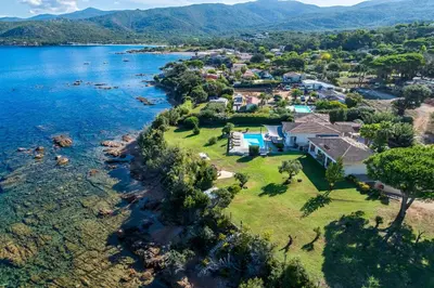 an aerial view of a house on the shore of a lake at Villa Aigue Marine - Front de mer in Coti-Chiavari