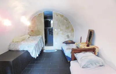 a room with two beds in a room with a hallway at Amazing Apartment In Partinello in Partinello