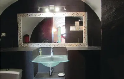 a bathroom with a sink and a mirror at Amazing Apartment In Partinello in Partinello