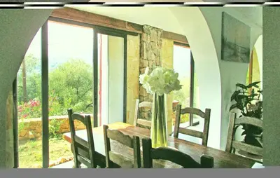 a dining room with a table with a vase of flowers at Amazing Apartment In Partinello in Partinello