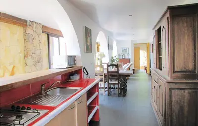 a kitchen with a sink and a counter top at Amazing Apartment In Partinello in Partinello