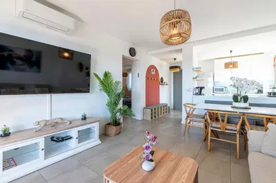 a beach with blue water and rocks and trees at Marylanca - PORTICCIO - double terrasse - Wifi - Clim - Parking Privé in Grosseto-Prugna