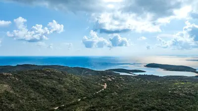 a view of the ocean from the top of a mountain at Villa F2 Tonnara pour 4 personnes, Rondinara, Bonifacio in Bonifacio
