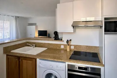 a kitchen with a sink and a dishwasher at Studio vue mer - Centre Ajaccio - 150 m cœur de ville in Ajaccio