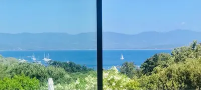 two views of a lake with boats in the water at Villa de charme et plage 5 mn à pied in Campomoro