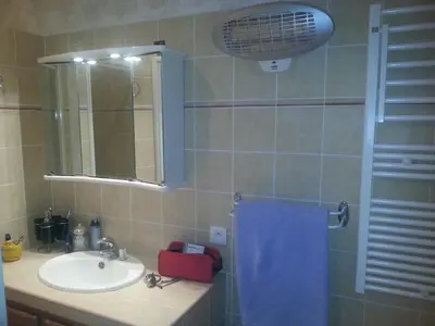 a bathroom with a sink and a mirror at Maison a Porto Pollo Corse du sud in Serra-di-Ferro