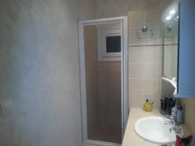 a bathroom with a shower and a sink at Maison a Porto Pollo Corse du sud in Serra-di-Ferro