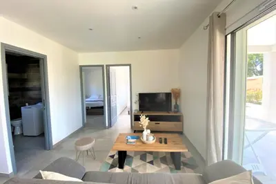 a living room with a couch and a table at Villa Oliu Di Santa Lucia in Conca