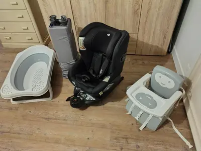 a suitcase sitting on the floor next to a dog carrier at Résidence des îles - Samos III in Ajaccio