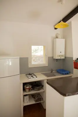 a kitchen with a sink and a counter top at Villa Lavezzi F2 2-4 pers Rondinara, Bonifacio in Bonifacio