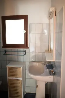a bathroom with a sink and a tub and a window at Villa RoccaPina 35 m2 - 2 - 4 people Rondinara, Bonifacio in Bonifacio