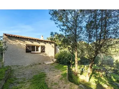 a small white house with a window and some trees at Villa Cala Rossa 45M2 4-5 pers Rondinara Bonifacio in Bonifacio