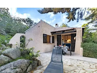 a house with a staircase in front of it at Villa Folaca 45m2 5 pers Rondinara Bonifacio in Bonifacio