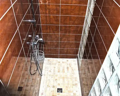 a shower with a hose hanging from the wall at Villa 65m2 7 pers - Rondinara, Bonifacio in Bonifacio