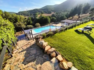 an aerial view of a villa with a swimming pool at JARDIN de PRATAVONE in Cognocoli-Monticchi