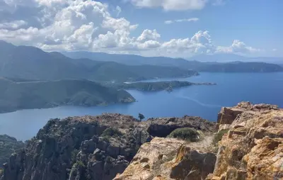 a view of a large body of water from a mountain at Grande Villa Piscine in Evisa