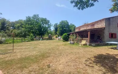 a large yard next to a building with a basketball hoop at Grande Villa Piscine in Evisa