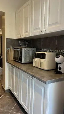 three microwaves on a counter in a kitchen at La villa Emmagathe in Poggio-Mezzana