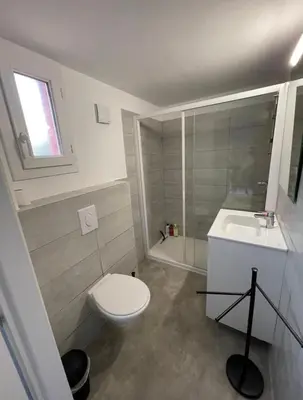a small bathroom with a toilet and a sink at Mini Villa - Les Hameaux de Saint Cyprien in Lecci