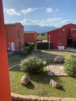 a yard with some rocks and some buildings at Mini Villa - Les Hameaux de Saint Cyprien in Lecci