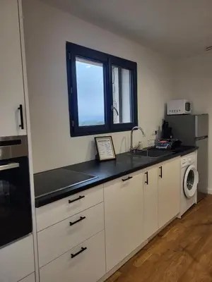 a kitchen with a sink and a window at Casa Gioia Maisonette à Sotta in Sotta