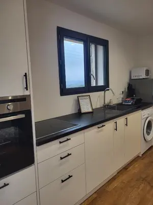 a kitchen with a sink and a window at Casa Gioia Maisonette à Sotta in Sotta