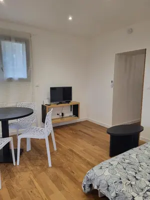 a room with a table and chairs and a tv at Casa Gioia Maisonette à Sotta in Sotta