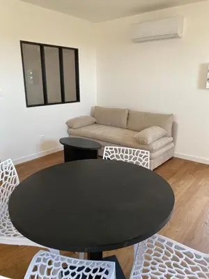 a living room with a black table and a couch at Casa Gioia Maisonette à Sotta in Sotta