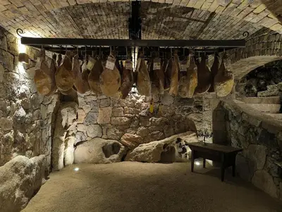 a room with a bunch of bags hanging from a wall at Port de Bonifacio in Bonifacio