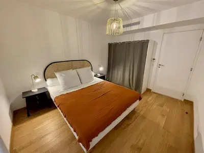 a bedroom with a large bed in a room at Port de Bonifacio in Bonifacio