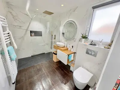 a bathroom with a toilet and a sink and a mirror at Villa avec piscine 8 personnes in Porto-Vecchio