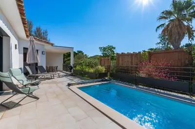 a swimming pool in a backyard with chairs and a patio at Villa U Veniqui 1 - Piscine privée in Conca