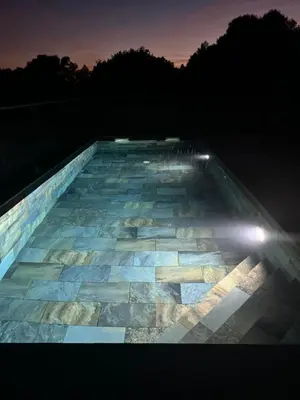a glass floor with lights on the top of a building at magnifique villa au calme avec superbe piscine in Figari