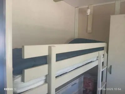 a bunk bed in a small room at Bungalow charmant à Sorbo-Ocagnano avec jardin in Sorbo-Ocagnano