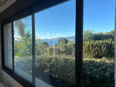 a window view of the ocean from a house at Appartement T3 vue mer et coucher de soleil sur les Îles Sanguinaires - climatisé in Pietrosella