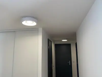 a room with a hallway with a door and a light at appartement ajaccio in Ajaccio