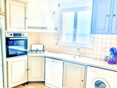 a kitchen with white cabinets and a dishwasher at Holiday Home Casa Orsoni 100m² by Interhome in Cannella