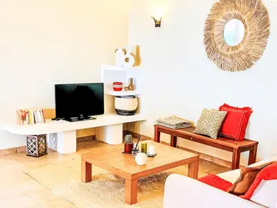 a living room with a tv and a coffee table at Holiday Home Casa Orsoni 100m² by Interhome in Cannella