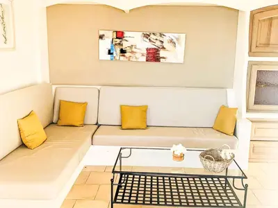 a living room with a couch with yellow pillows at Holiday Home Casa Orsoni 80m² by Interhome in Cannella