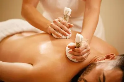 a woman laying on a towel in a bath tub at Cabane Sauna & Jacuzzi Hiver in Vaccili