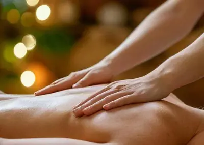 a woman laying on the back of a bed with her hands at Cabane Sauna & Jacuzzi Hiver in Vaccili