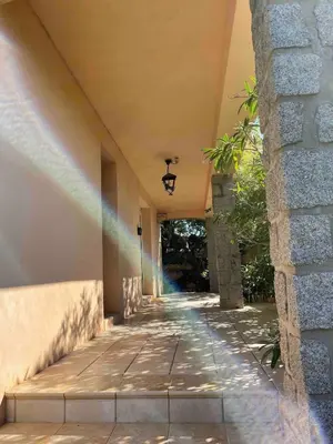 an empty hallway of a building with a street light at Maison Bon Aria familiale vue mer 5 min plages in Porto-Vecchio