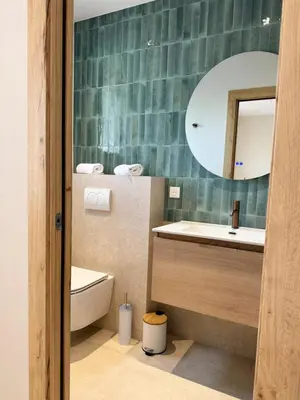 a bathroom with a toilet and a sink at Résidence A Me Vita - Villas avec piscine privée à Porto-Vecchio in San-Gavino-di-Carbini