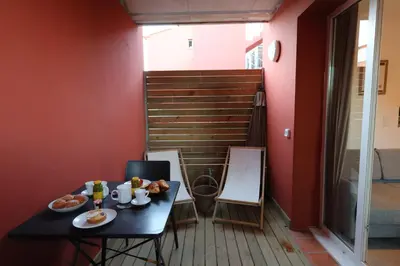 a table with food on it in a room at U Bellu - Modernité et calme à deux pas de la mer in Lecci